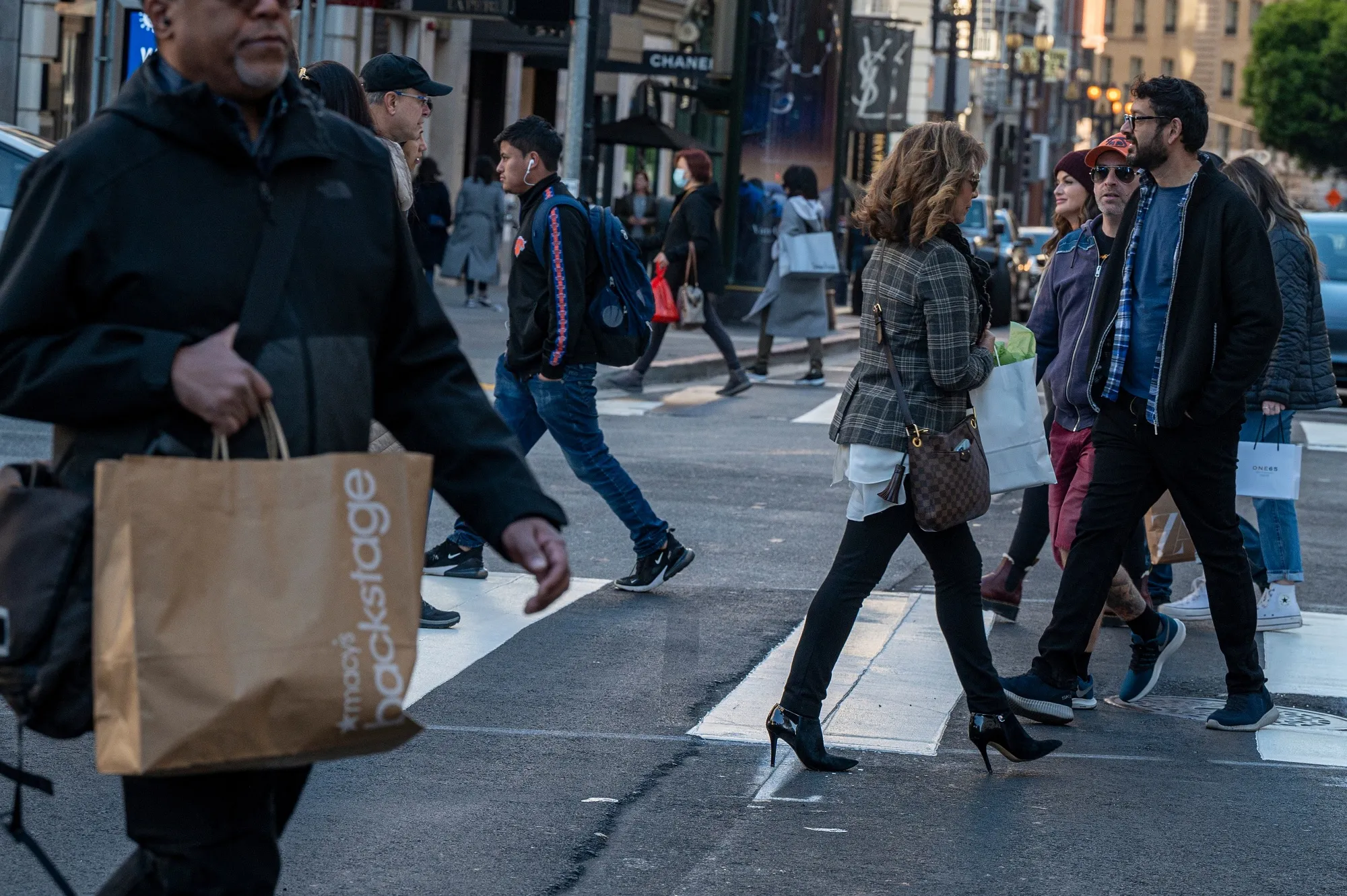Shoppers cross Geary Street in San Francisco on Black Friday.