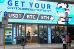 Bitcoin, ethereum and the stablecoin USDT are promoted at a cryptocurrency store in Hong Kong on July 29, 2025. Stablecoin excitement has gripped Hong Kong as the city prepares to launch a licensing system for the less volatile type of cryptocurrency, but authorities warn against overplaying its future role in financial systems. (Photo by Peter PARKS / AFP) / To go with AFP story Hong Kong-China-cryptocurrency-banking-tech, FOCUS by Holmes Chan, with Katie Forster in Tokyo (Photo by PETER PARKS/AFP via Getty Images)