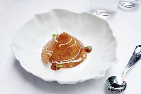 This crisp dosa hides many kinds of mushrooms.