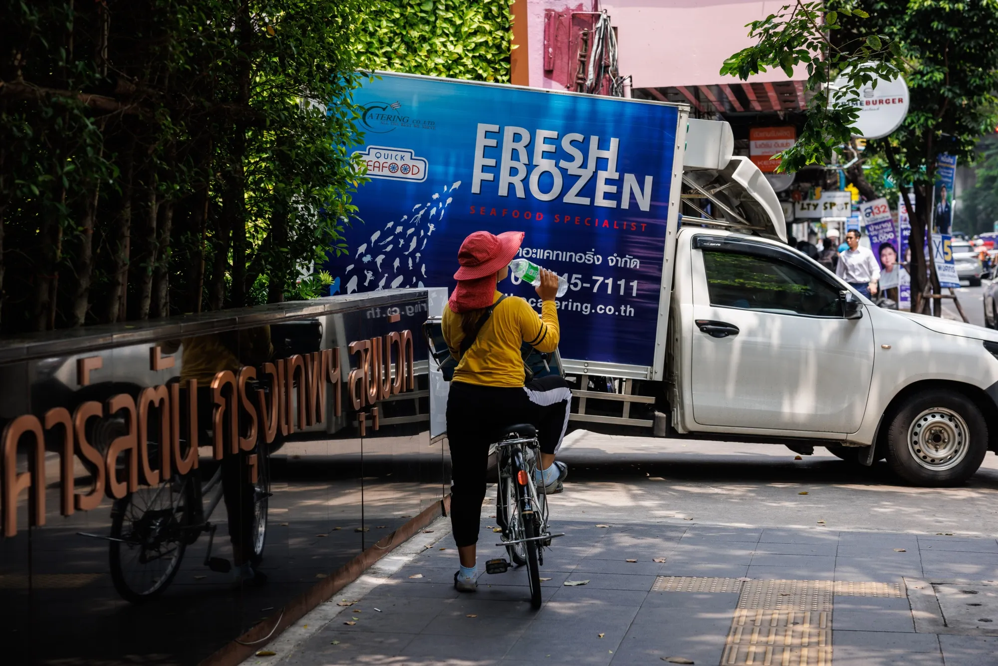 A cyclist stops to drink water during a heat wave in Bangkok, Thailand, on Thursday, April 27, 2023.&nbsp;