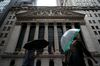 NEW YORK, NY - OCTOBER 11: People walk past the New York Stock Exchange (NYSE) on a rainy day in the Financial District, October 11, 2018 in New York City. Following a massive sell-off of over 800 points on Wednesday, the Dow Jones Industrial Average fell over 100 points in Thursday morning trading. (Photo by Drew Angerer/Getty Images)