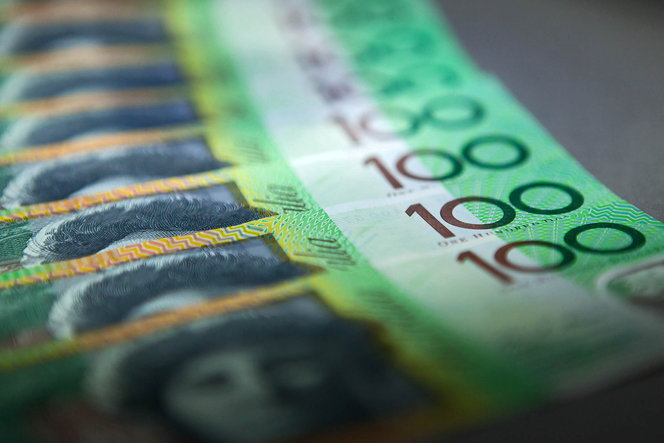 Australian one-hundred dollar banknotes are arranged for a photograph in Sydney, Australia, on Wednesday, April 17, 2013. Direct trading between the Australian dollar and yuan started on April 10.
