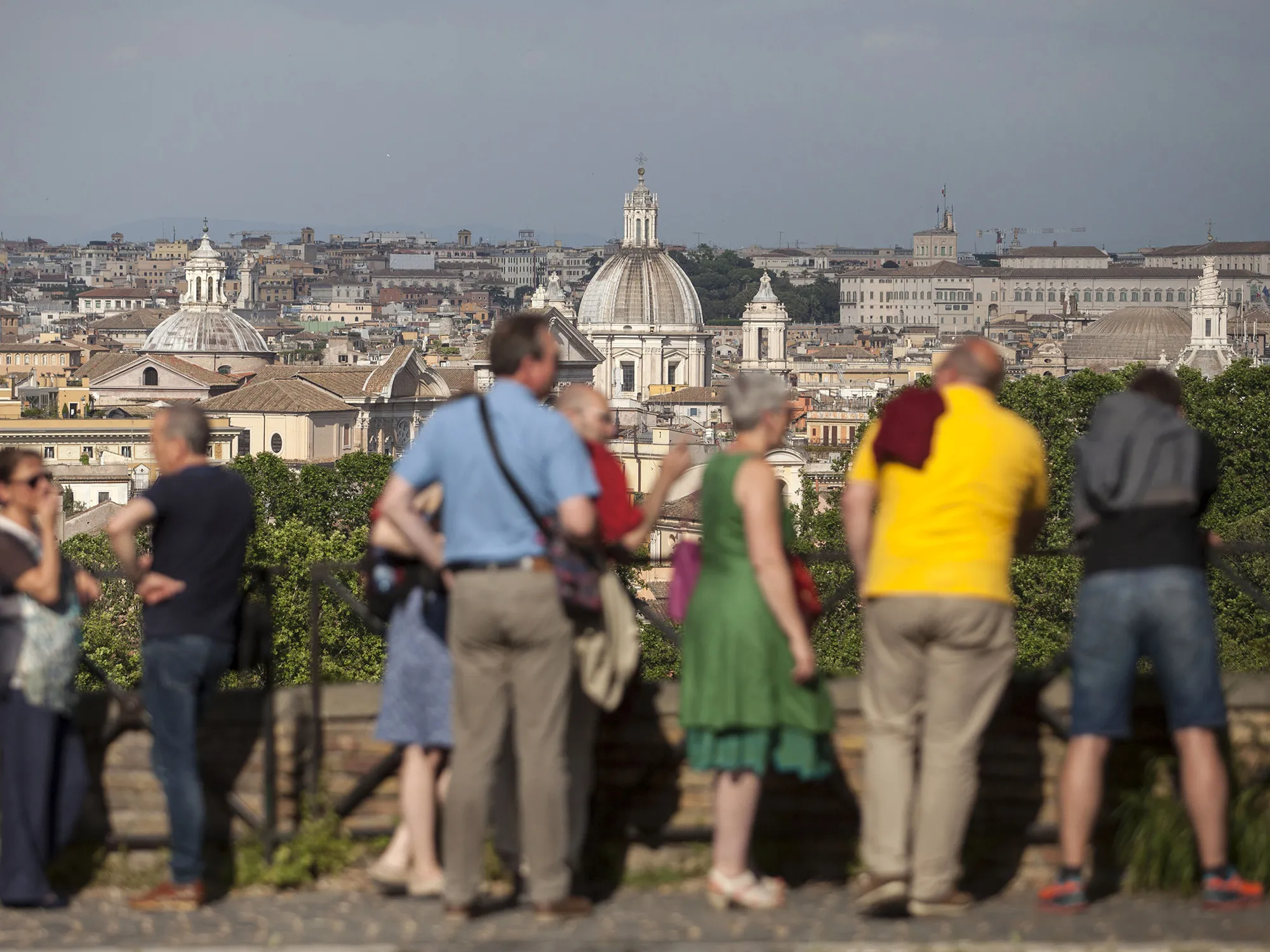 Visitors look across the skyline in Rome.