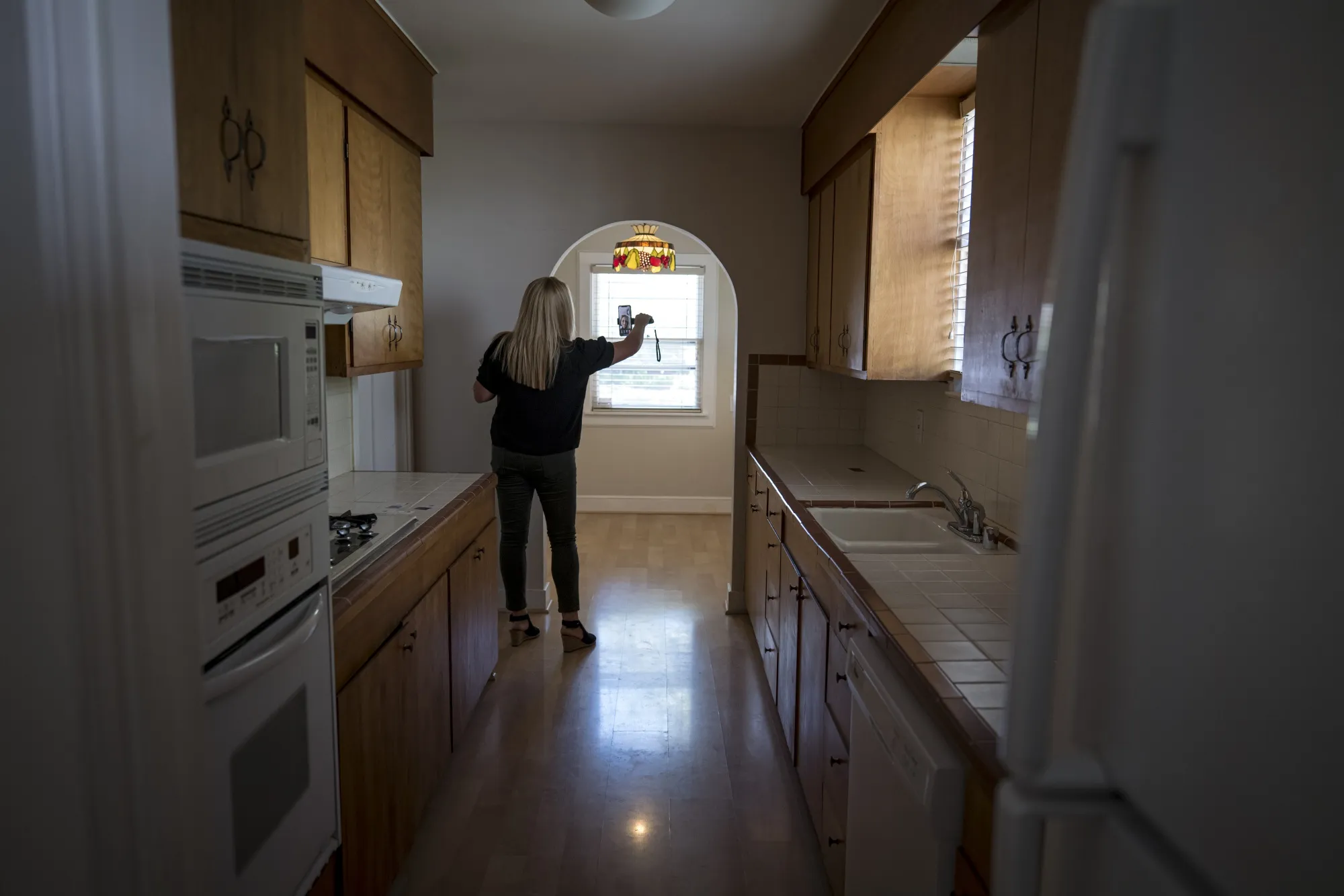 A realtor&nbsp;uses a smartphone to provide a virtual video tour of a home for sale in Sacramento, California.