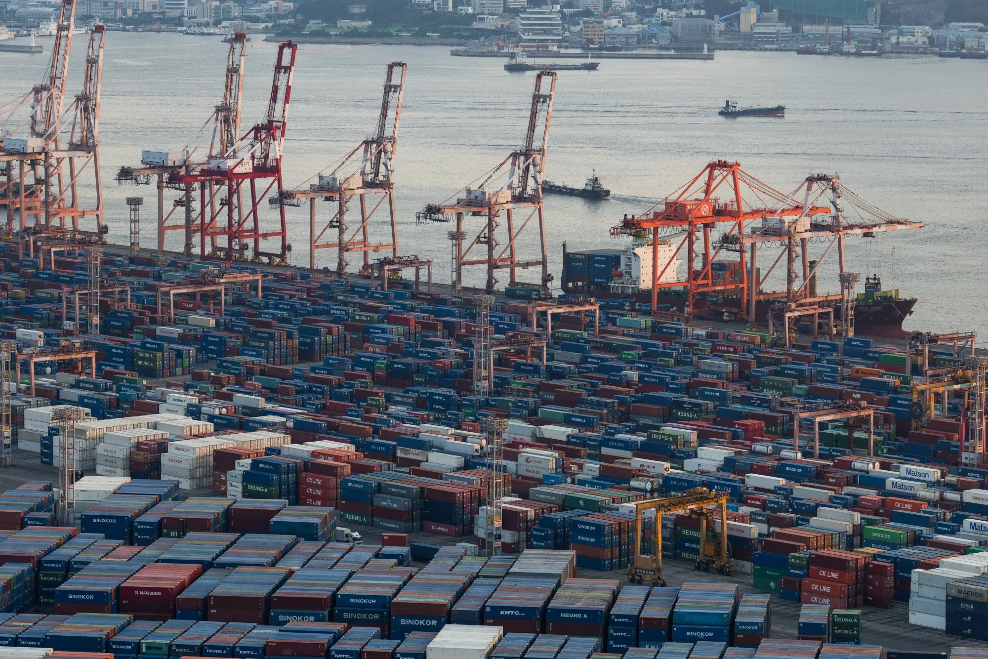 Gantry cranes and shipping containers at the Busan Port Terminal in Busan, South Korea.