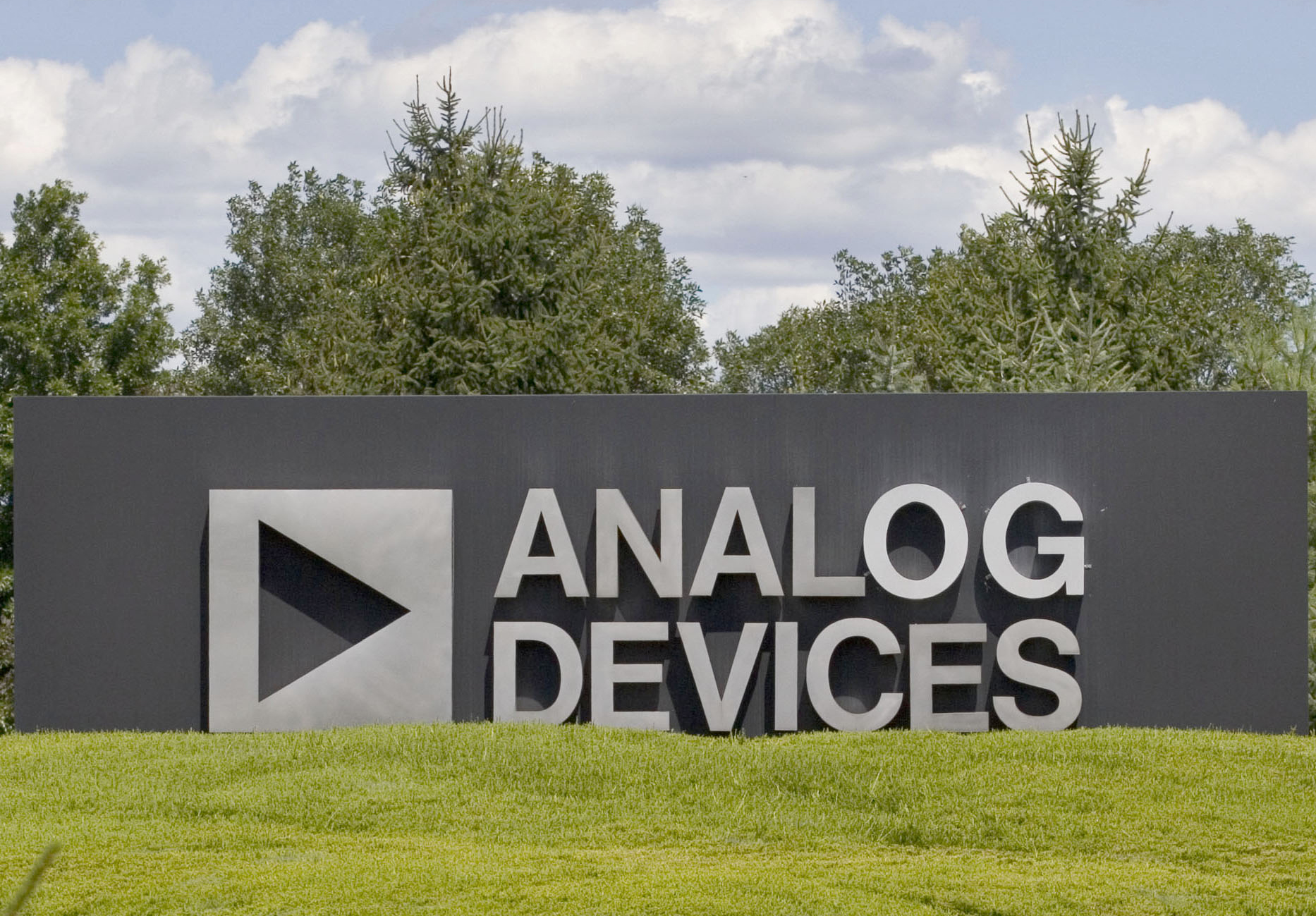 A sign outside Analog Devices Inc. offices in Norwood, Massachusetts Photographer: Jb Reed/Bloomberg