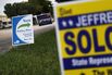 A sign shows the way to the polling place as people vote in the Florida primary on Aug. 30, 2016, in Miami.
