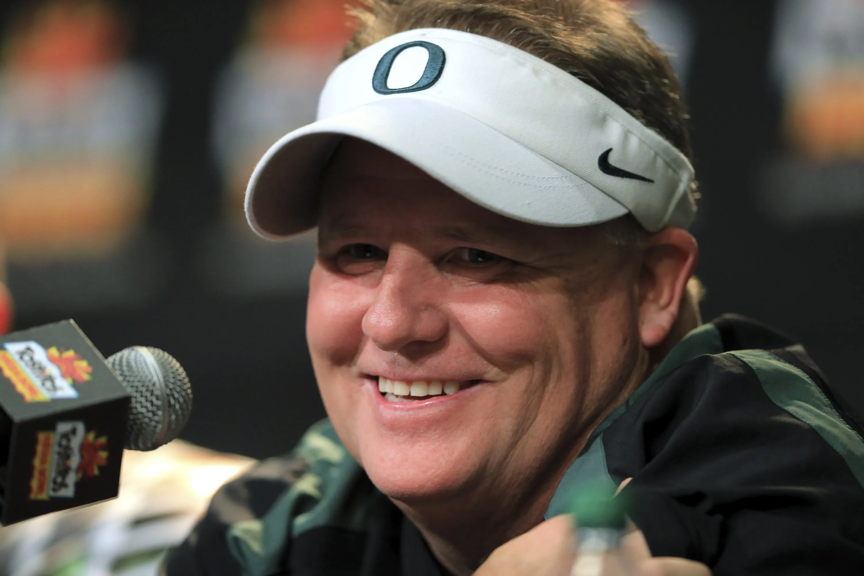 University of Oregon head football coach Chip Kelly smiles during a post-game press conference after winning the Tostitos Fiesta Bowl in Glendale, Arizona, on Jan. 3, 2013. Photographer: Doug Pensinger/Getty Images