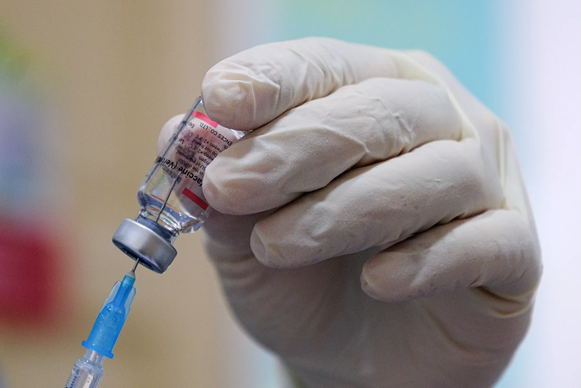 A health worker prepares to administer a booster dose of the Sinovac Biotech Covid-19 vaccine in Malaysia on Dec. 8.