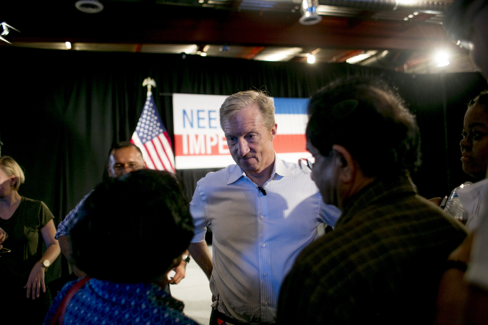 Tom Steyer listens to attendees during a &quot;Need To Impeach&quot; event in Detroit on Aug. 13, 2018.