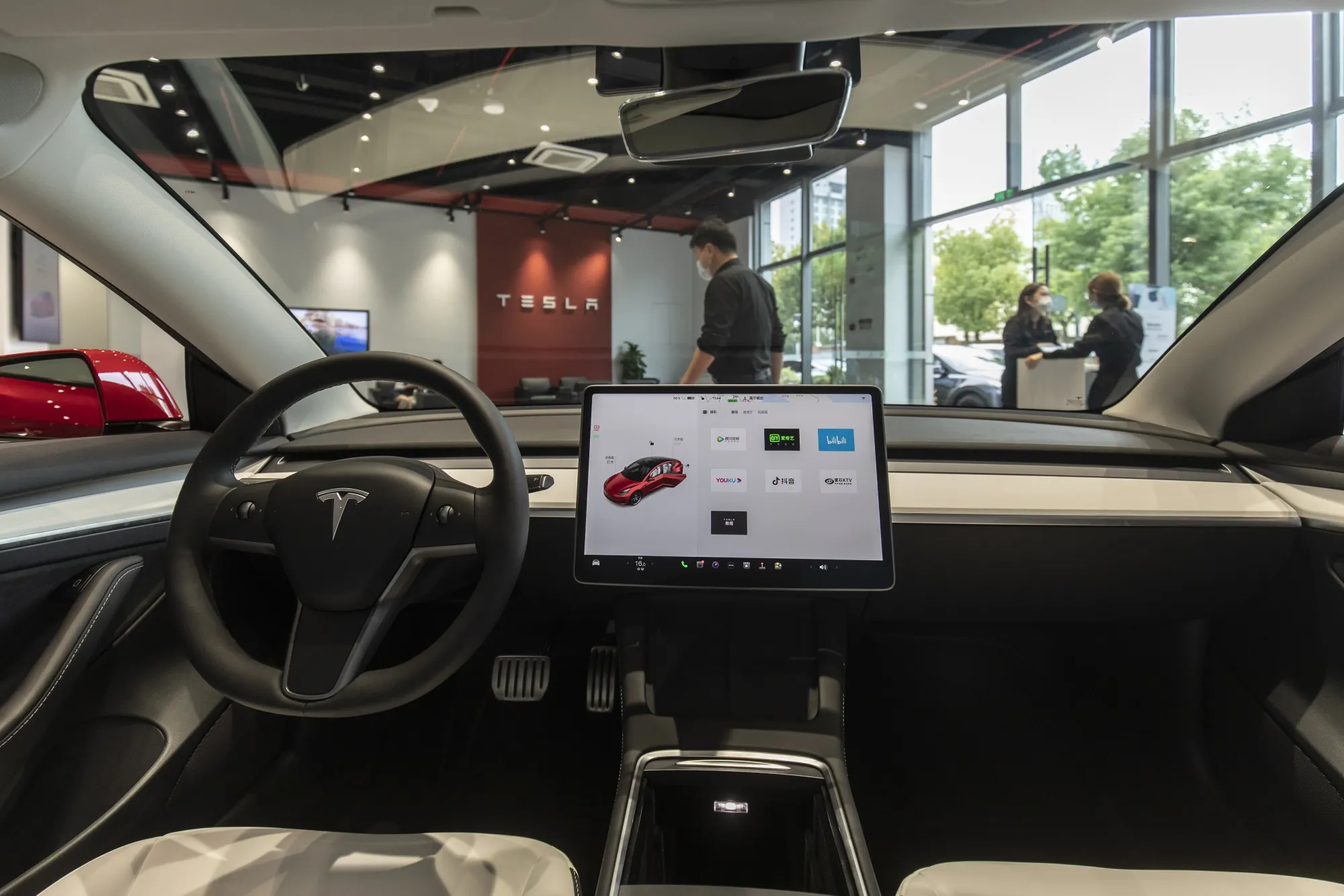 Customers at a Tesla&nbsp;showroom in Shanghai.