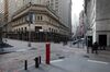 Wall Street nearly empty in front of the New York Stock Exchange (NYSE) in New York, U.S., on Monday, Jan. 4, 2021. In a historic year that marked a rapid plunge into bear market territory and a swift recovery into the bull zone, high-flying technology stocks and electric-vehicle pioneer Tesla Inc. were standout trades.