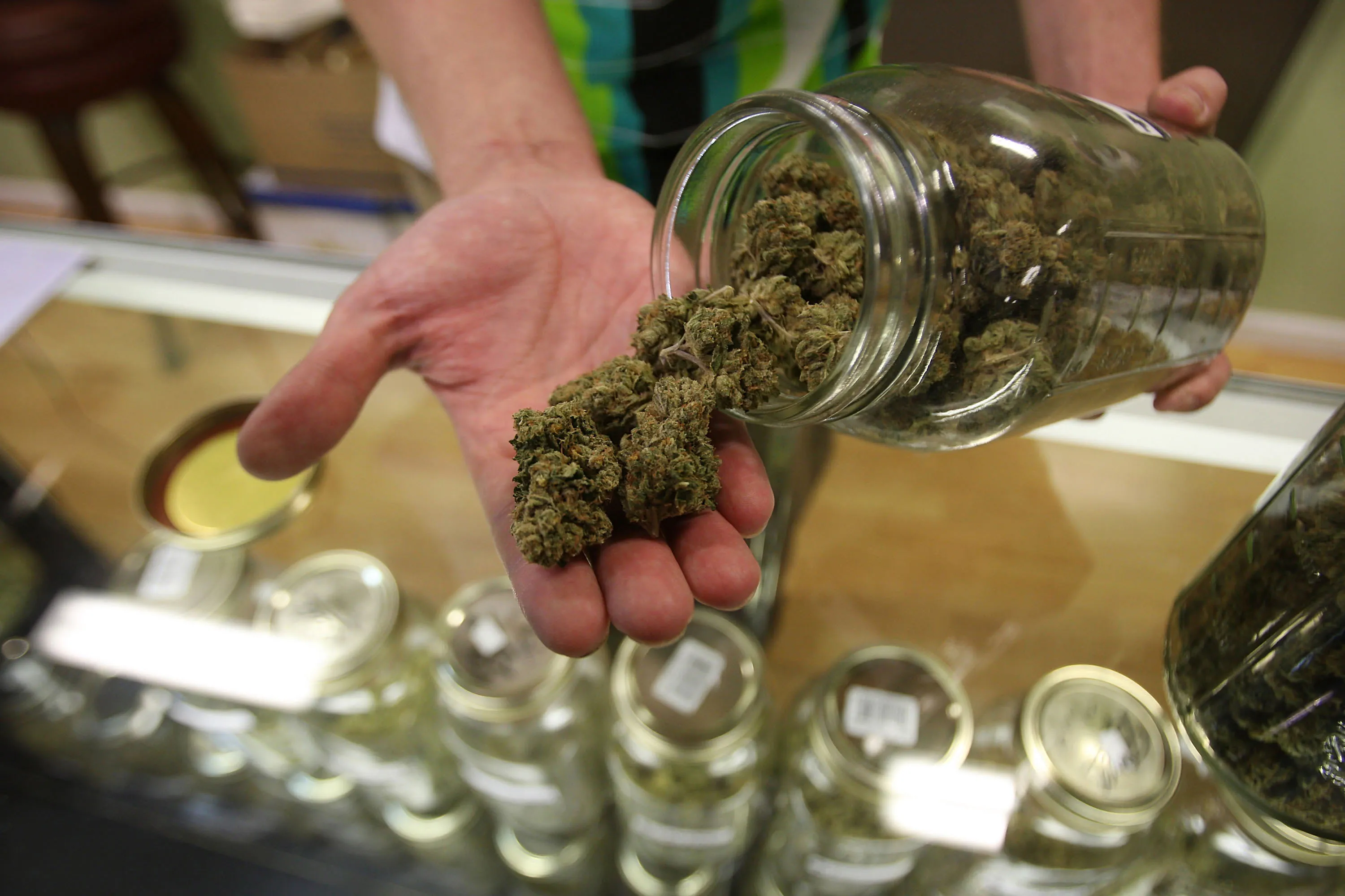 A person displays various types of marijuana available at a dispensary&nbsp;in Los Angeles.