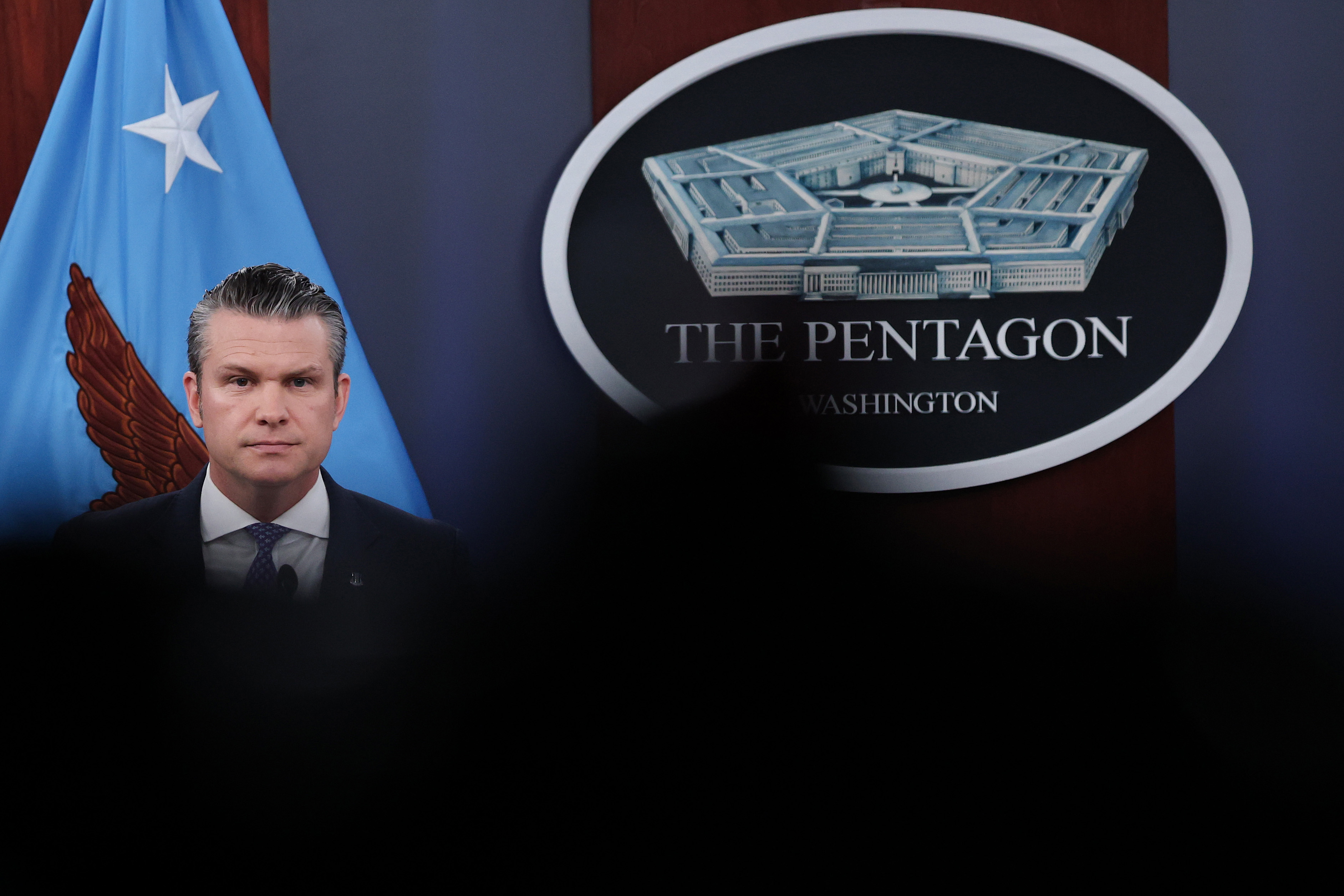 ARLINGTON, VIRGINIA - MARCH 31: U.S. Secretary of War Pete Hegseth looks on during a press briefing at the Pentagon on March 31, 2026 in Arlington, Virginia. The U.S. and Israel have continued their joint attack on Iran that began on February 28. (Photo by Win McNamee/Getty Images) Photographer: Win McNamee/Getty Images North America