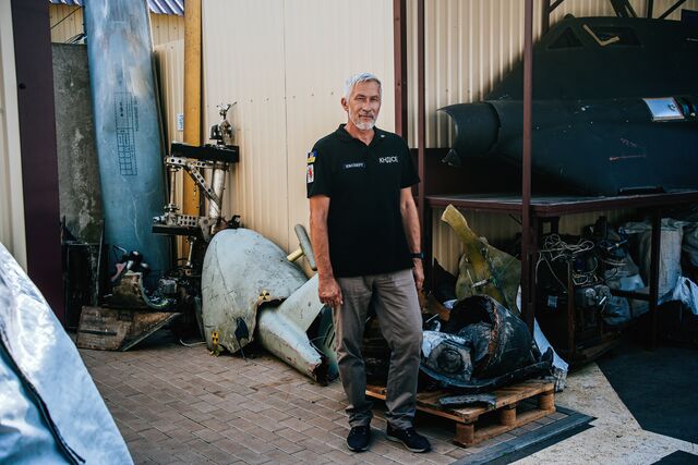 Oleksandr Vysikan, an investigator at the Kyiv Scientific Research Institute of Forensic Expertise, outdoors with some of the parts he and other Ukrainian investigators have salvaged and cataloged after Russian missile attacks. 