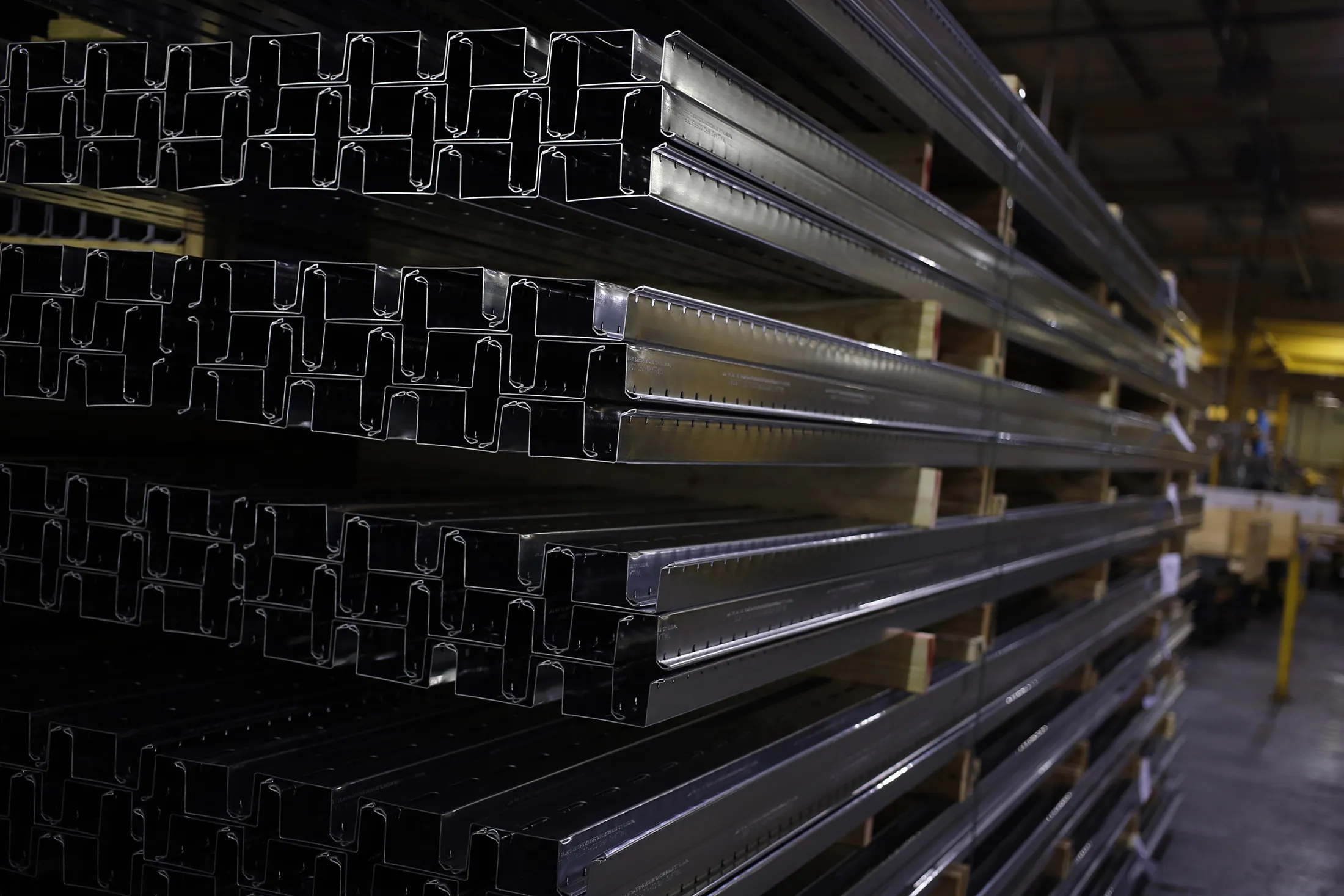 Metal components for office cubicles and furniture are stacked in a storage area after being manufactured at the Roll Forming Corp. plant in Shelbyville, Kentucky, U.S. on Monday, Jan. 6, 2014. U.S. factory orders in November rose 1.8 percent from the previous month, the Census Bureau reported.
