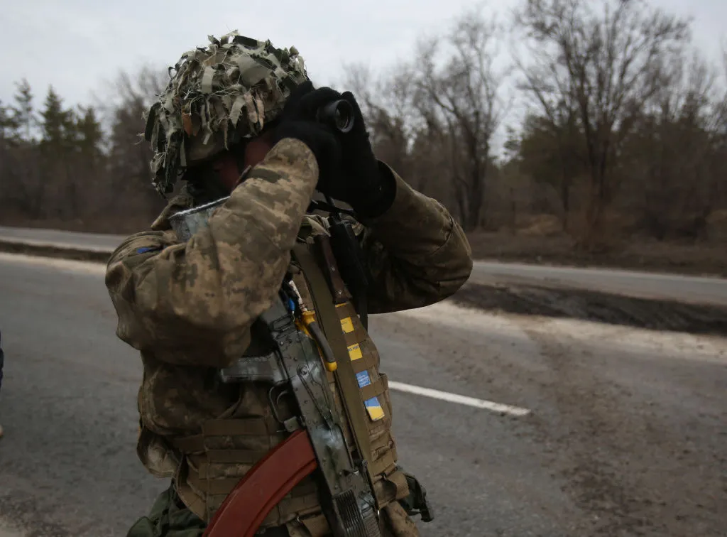 Ukrainian servicemen get ready to repel an attack in the Lugansk region yesterday.