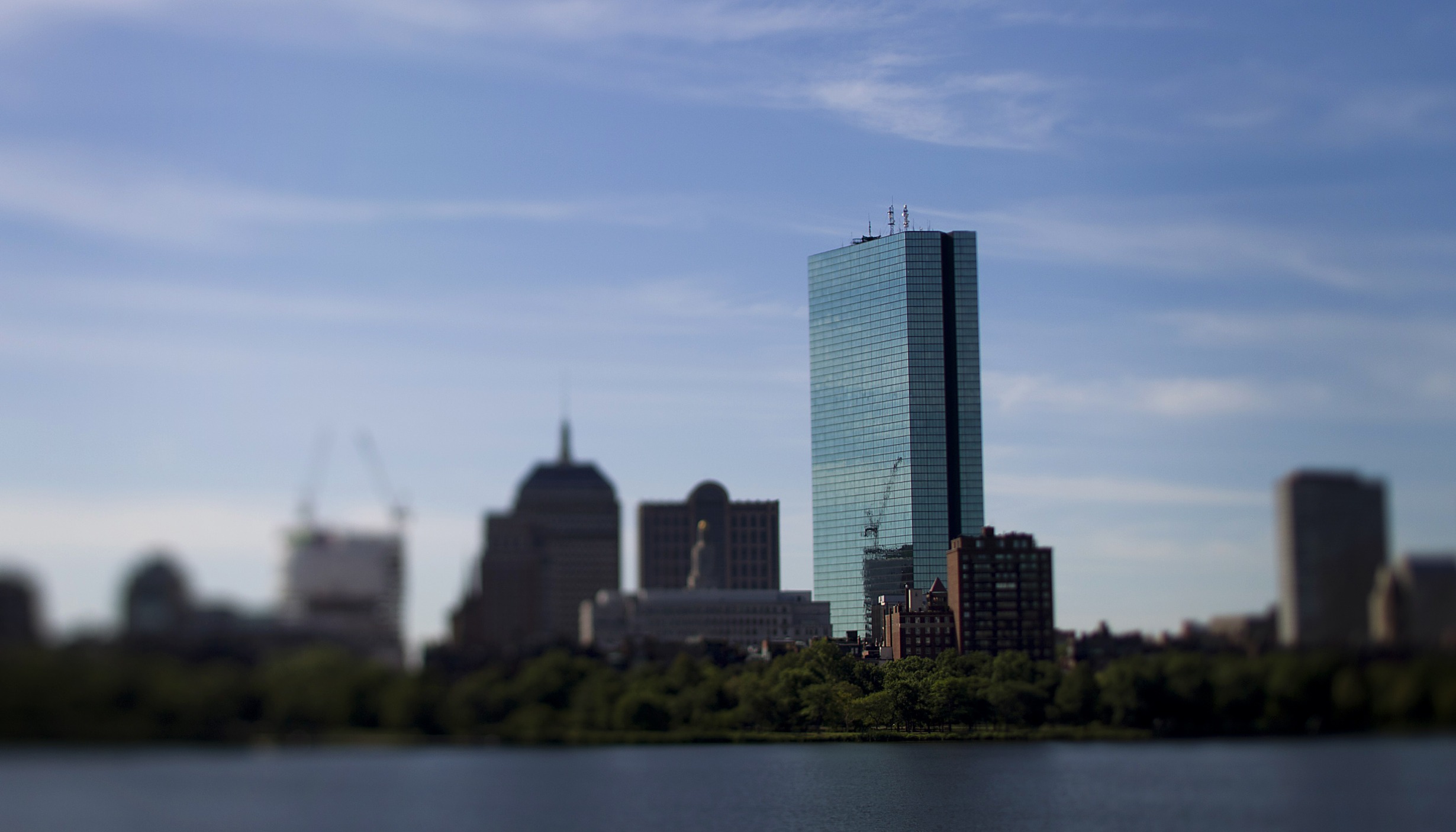 The John Hancock Tower, Bain Capital LLC's headquarters, stands in this photo taken with a tilt shift lens in Boston, Massachusetts, U.S., on Tuesday, Aug. 7, 2012. Boston, a leading city for finance, has an economic base that includes research, manufacturing, and biotechnology. Photographer: Brent Lewin