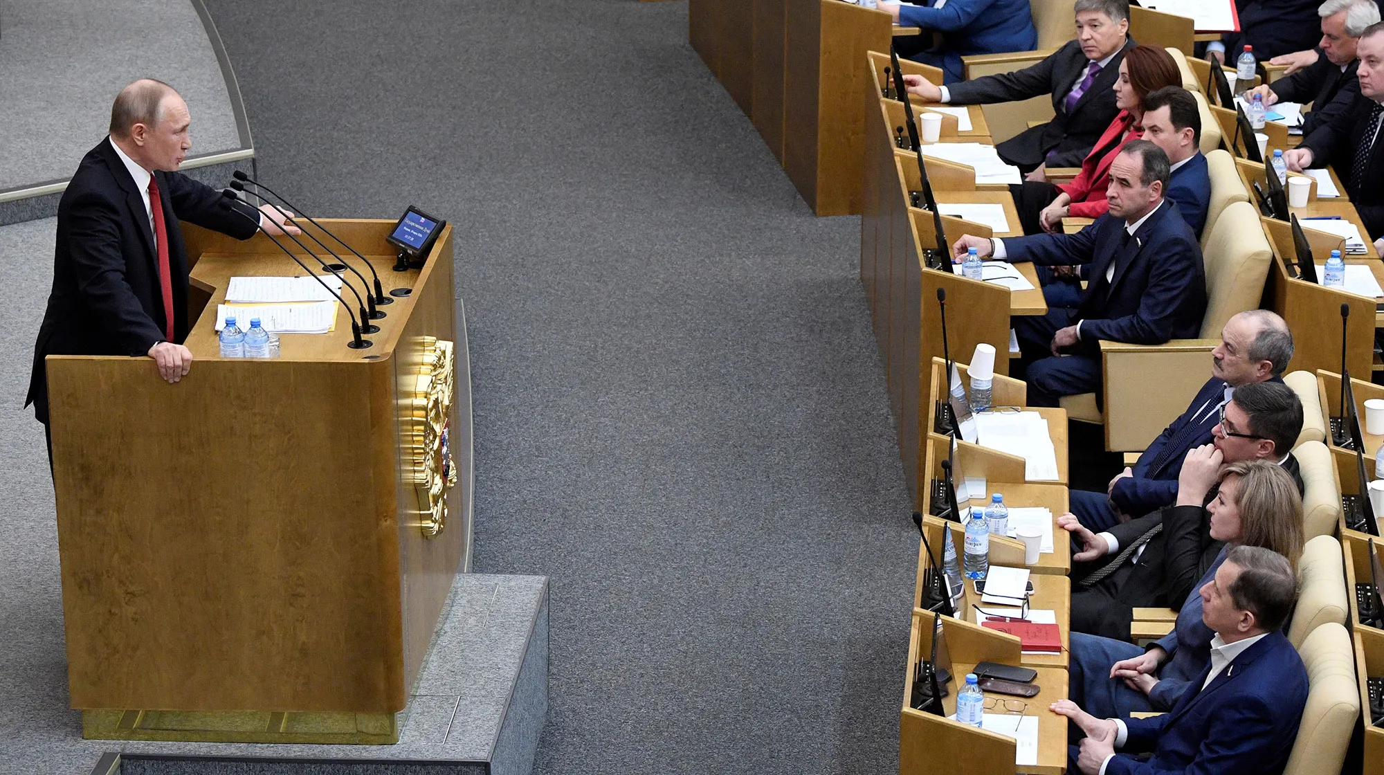 Vladimir Putin addresses lawmakers during a session of the State Duma in Moscow on March 10.