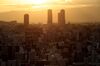 Commercial and residential buildings are on the horizon at dusk in Osaka, Japan, Thursday, May 21, 2020. Japanese Prime Minister Shinzo Abe told reporters that if current trends of new infections continue, he believes it is possible to lift the state of emergency.  in Tokyo, as well as the surrounding prefectures and Hokkaido as early as May 25.  Abe was speaking when the emergency was lifted in Osaka and two neighboring prefectures.