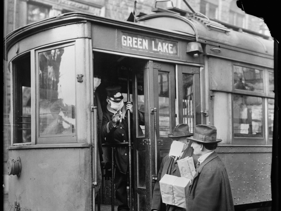 A conductor checks to see if potential passengers are wearing masks in Seattle, Washington.