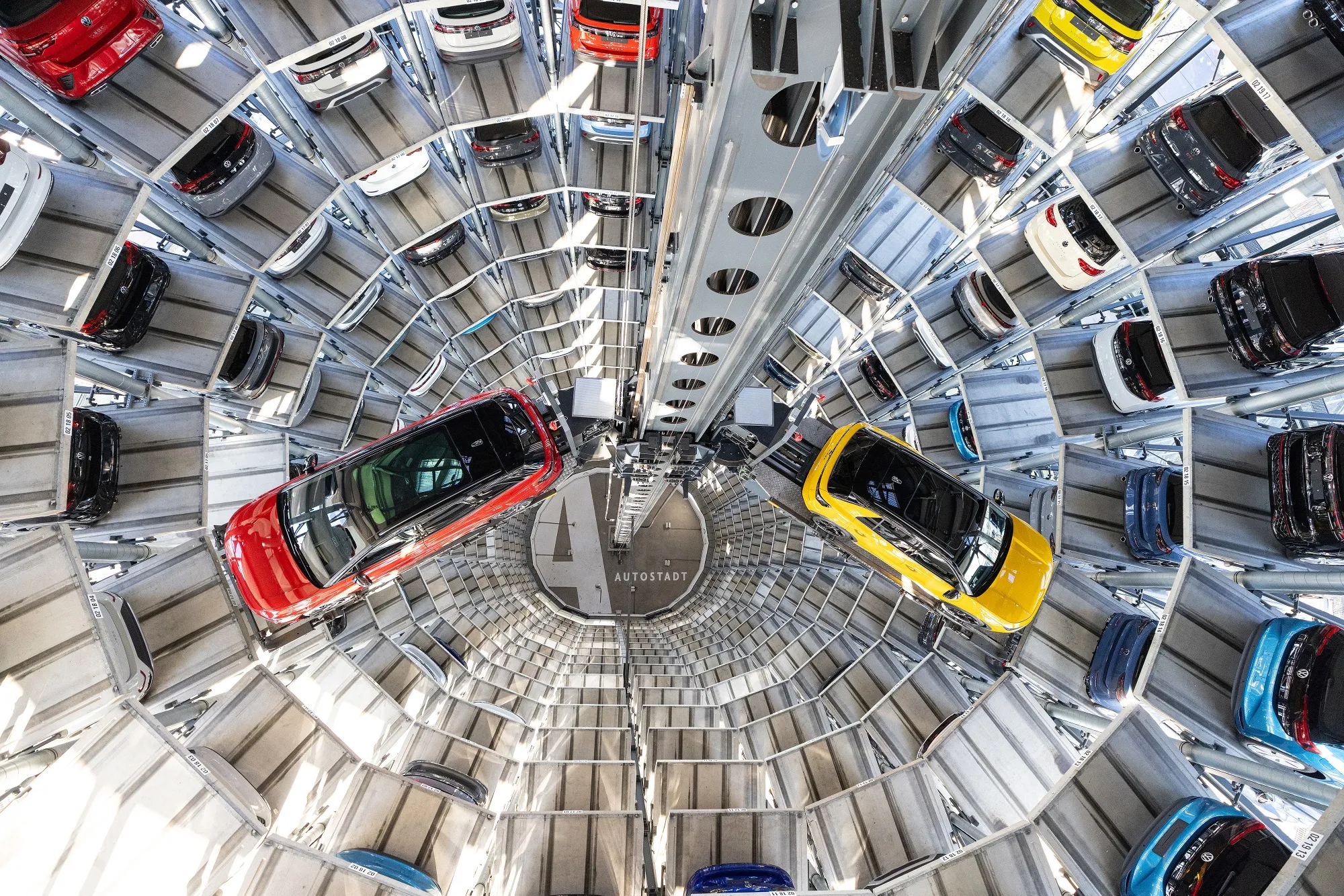 Vehicles inside an Autostadt Delivery Tower at the Volkswagen AG headquarters in Wolfsburg, Germany.