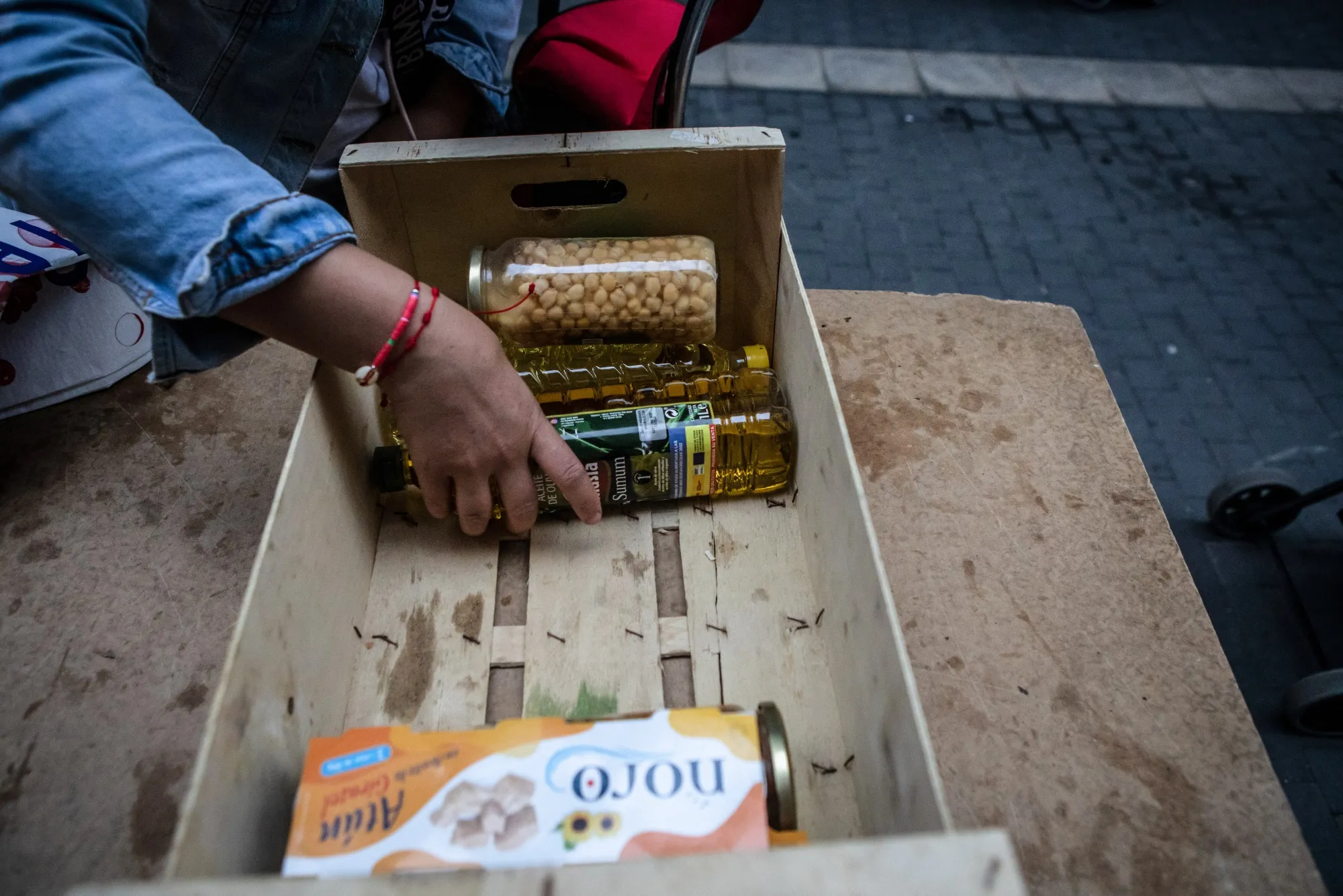 A resident receives groceries at a food bank in&nbsp;Barcelona, Spain.