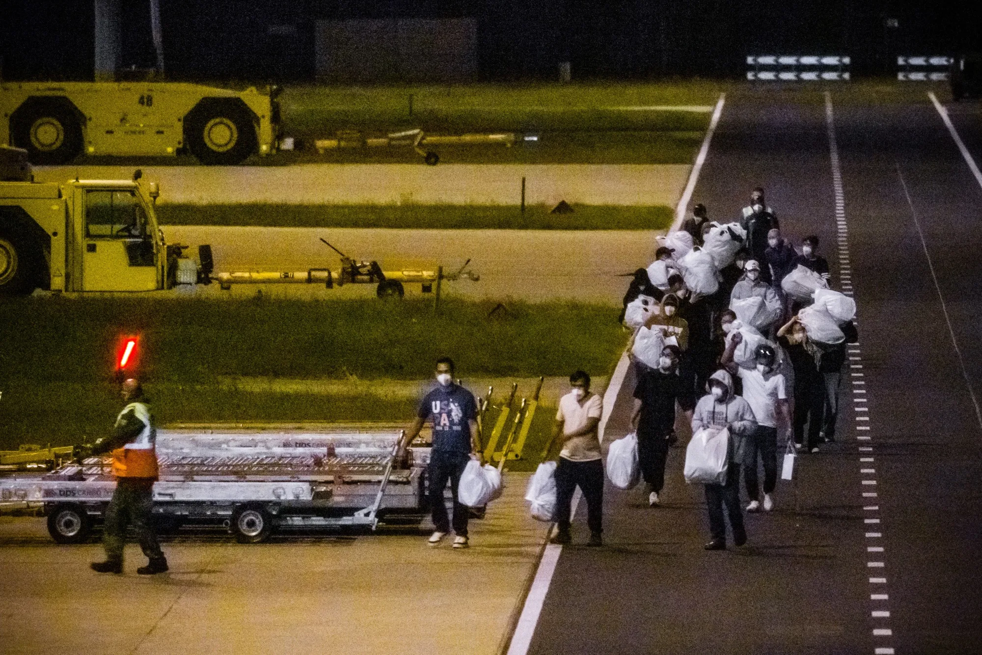 Passengers on a third evacuation flight from Tenerife arrive at Eindhoven Air Base in Eindhoven, Netherlands on May 12.
