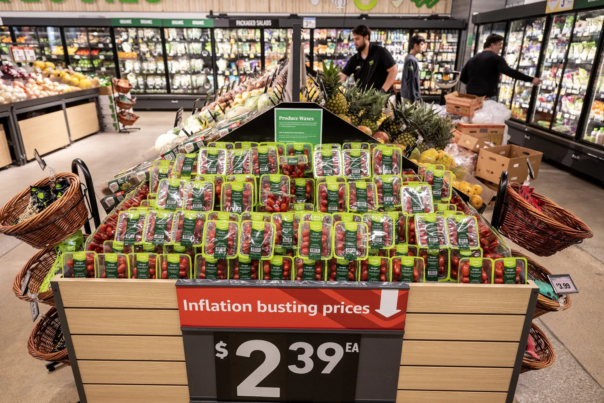 A sign advertises "inflation busting prices" at an Amazon Fresh grocery store in Schaumburg, Illinois, US, on Monday, July 24, 2023.&nbsp;