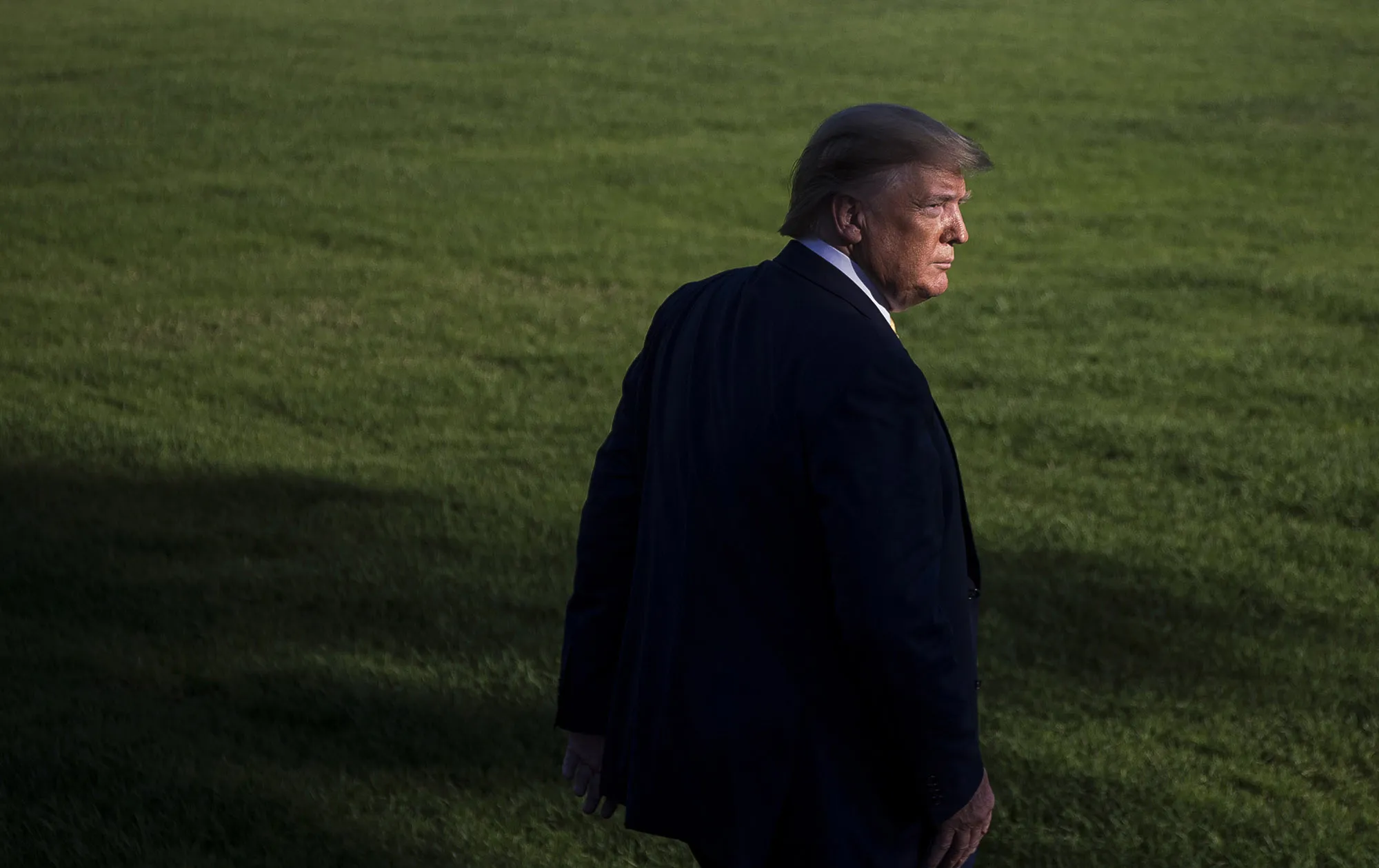 Donald Trump walks on the South Lawn before boarding Marine One at the White House in Washington, D.C.