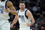 Dallas Mavericks guard Luka Doncic (77) celebrates a basket against the Phoenix Suns during the first half of Game 7 of an NBA basketball Western Conference playoff semifinal, Sunday, May 15, 2022, in Phoenix. (AP Photo/Matt York)