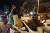 People celebrate the recapturing of Khartoum, in Port Sudan, on March 26.
