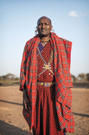 Three Maasai men wearing the distinctive shuka cloth in Kenya