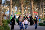Families walk near the Red Sea beaches of King Abdullah Economic City