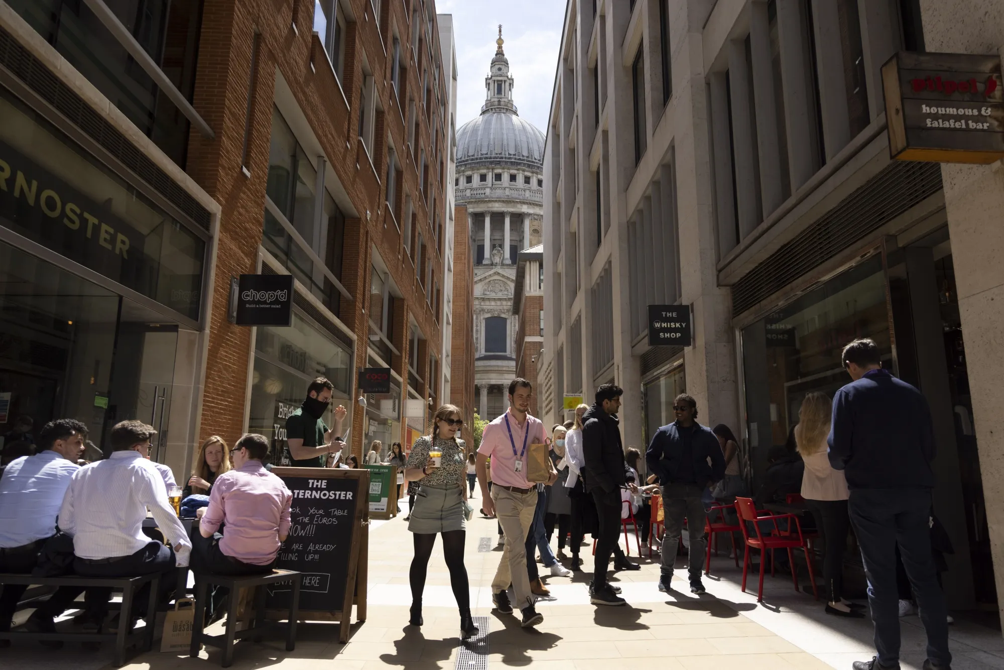 Workers buy lunch in view of St. Paul's Cathedral in The City of London on May 27.