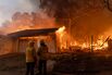 Thousands Flee From Uncontrolled Wildfires Burning Near LA