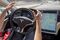 A member of the media test drives a Tesla Motors Inc., Model S car equipped with Autopilot at the Tesla Motors Inc. headquarters in Palo Alto, California, U.S., on Wednesday, Oct. 14, 2015. Tesla Motors Inc. will begin rolling out the first version of its highly anticipated “autopilot” features to owners of its all-electric Model S sedan Thursday. Autopilot is a step toward the vision of autonomous or self-driving cars, and includes features like automatic lane changing and the ability of the Model S to parallel park for you. Photographer: David Paul Morris/Bloomberg