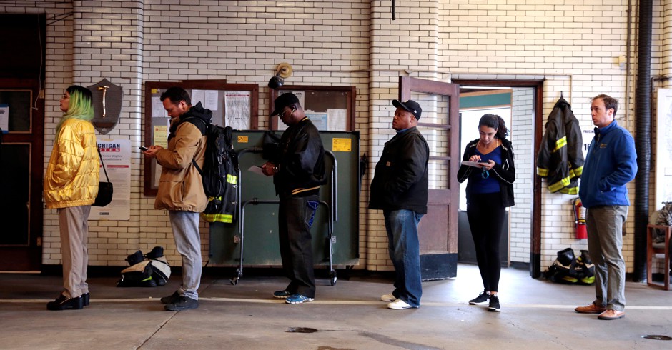 Voters wait at a Detroit fire station to cast their ballots during the 2018 November midterm elections. Nearly 75 percent of Michigan's population lives in urban areas. Voter turnout in Michigan's urban areas dropped in 2016, contributing to Donald Trump's narrow victory over Hilary Clinton in the state.