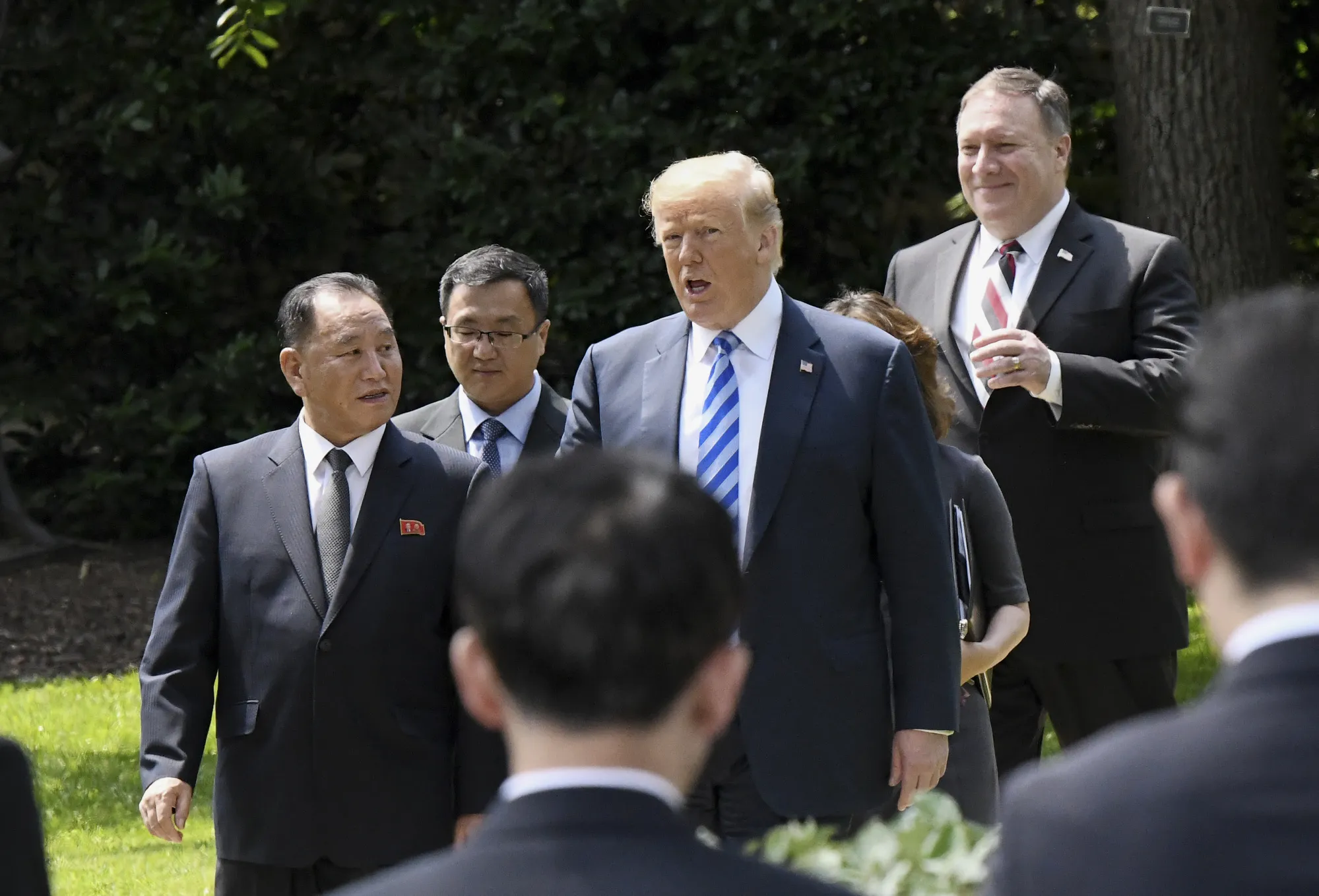 President Donald Trump, center, walks with Kim Yong Chol,&nbsp;left, and Mike Pompeo, right, on the South Lawn of the White House on June 1.&nbsp;