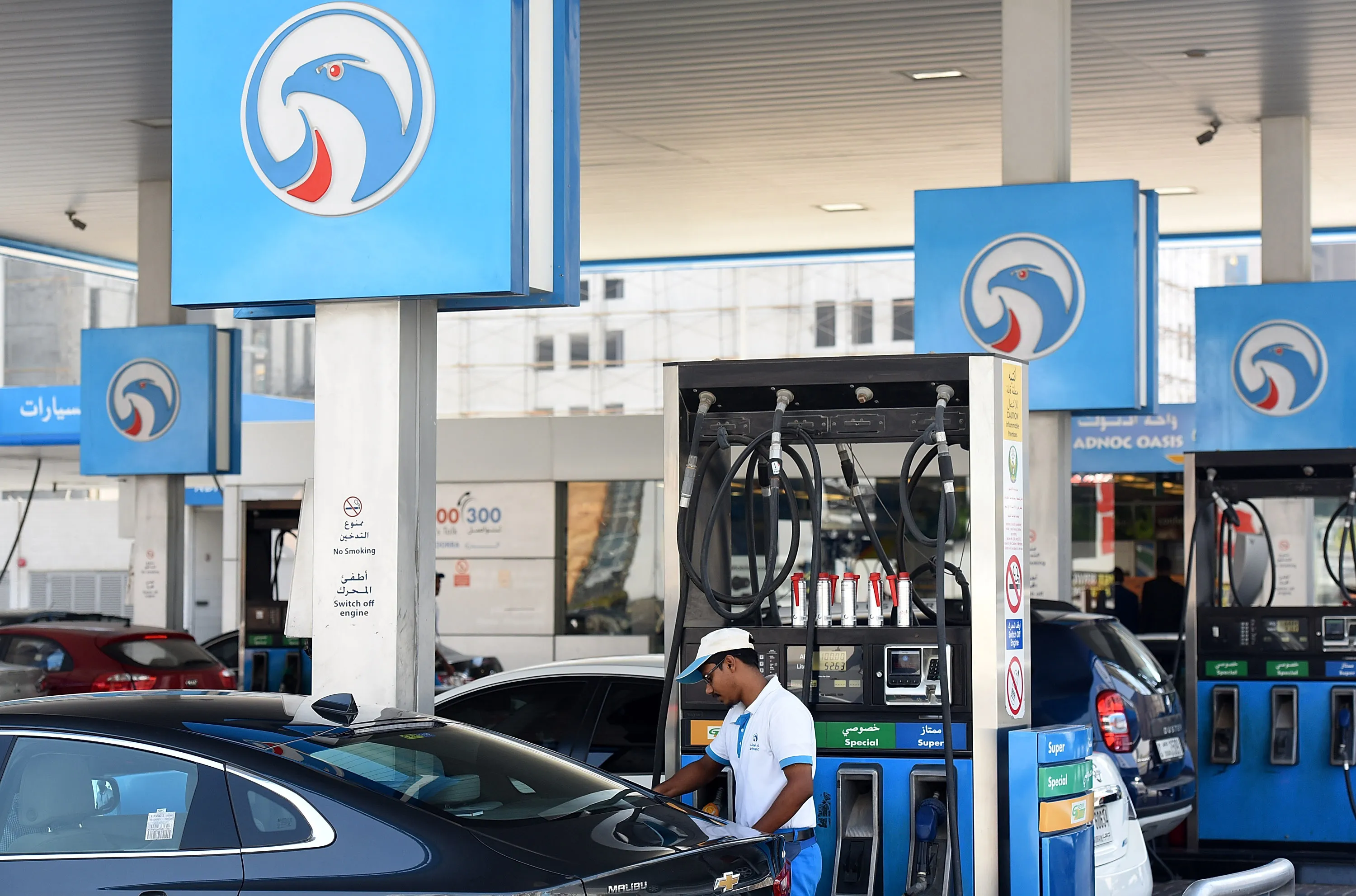 An attendant works at an Adnoc petrol station&nbsp;in Dubai.