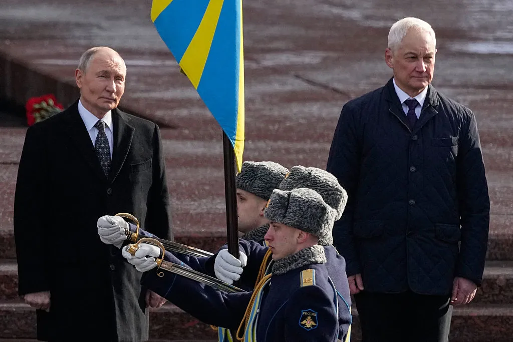 Vladimir Putin , left and Andrei Belousov.