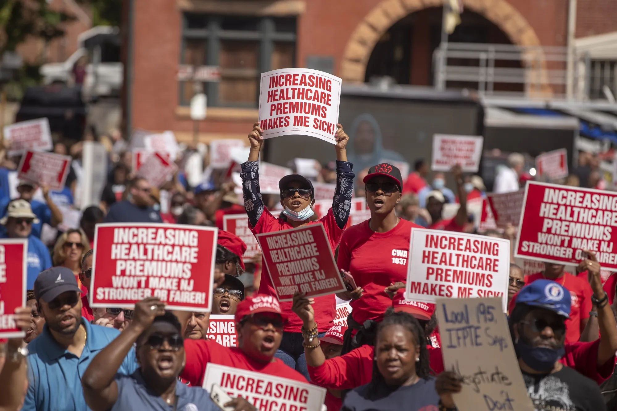 Demonstrators during a union rally outside the State House in Trenton, New Jersey on September 13.