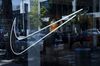 The Nike Inc. logo is displayed in the window of the Nike by Melrose live concept store in West Hollywood, California, U.S., on Monday, July 30, 2018.