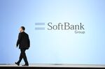 Masayoshi Son, chairman and chief executive officer of SoftBank Group Corp., leaves the stage following a news conference in Tokyo, Japan.