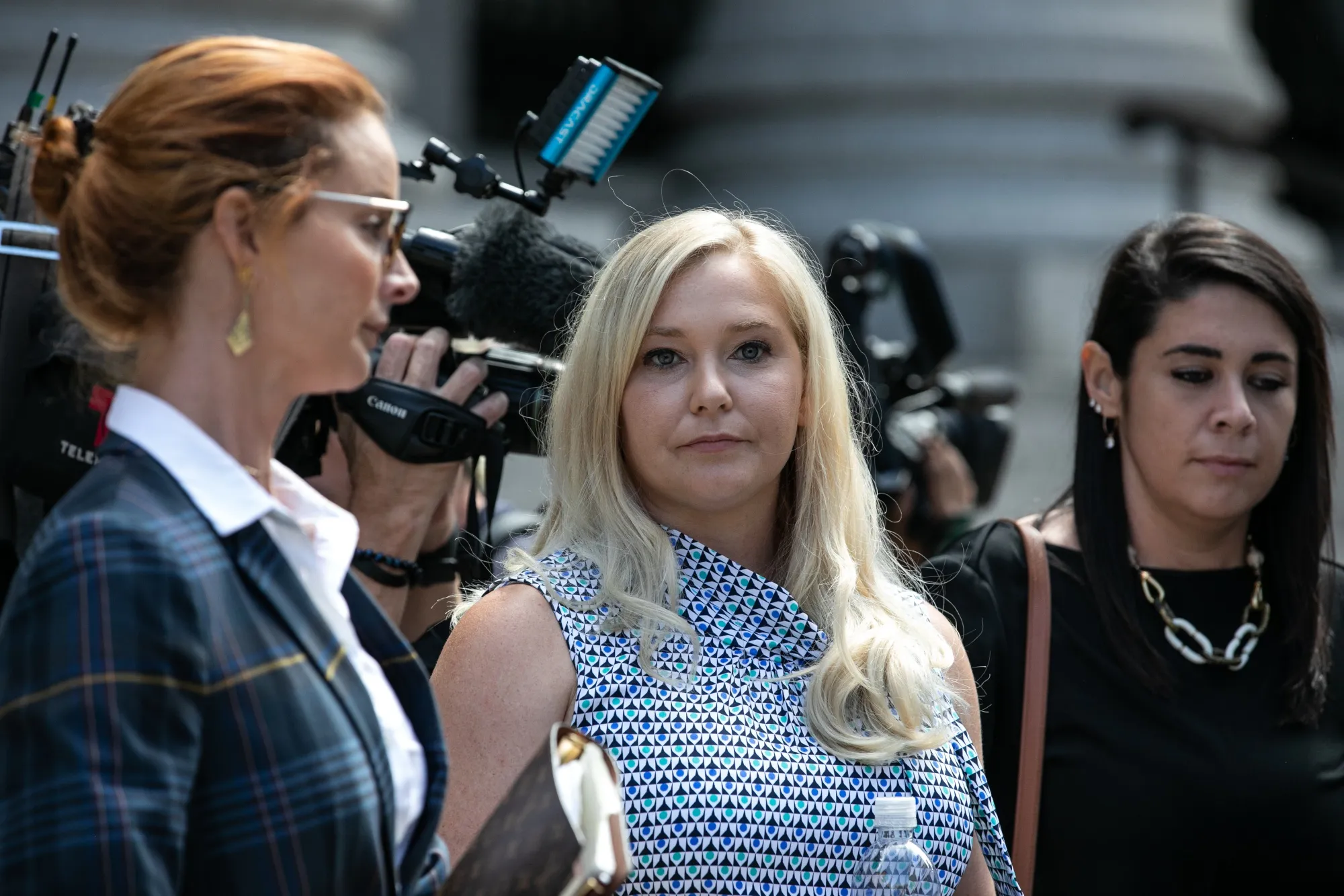 Virginia Giuffre, center, exits from federal court in New York, on Aug. 27, 2019.