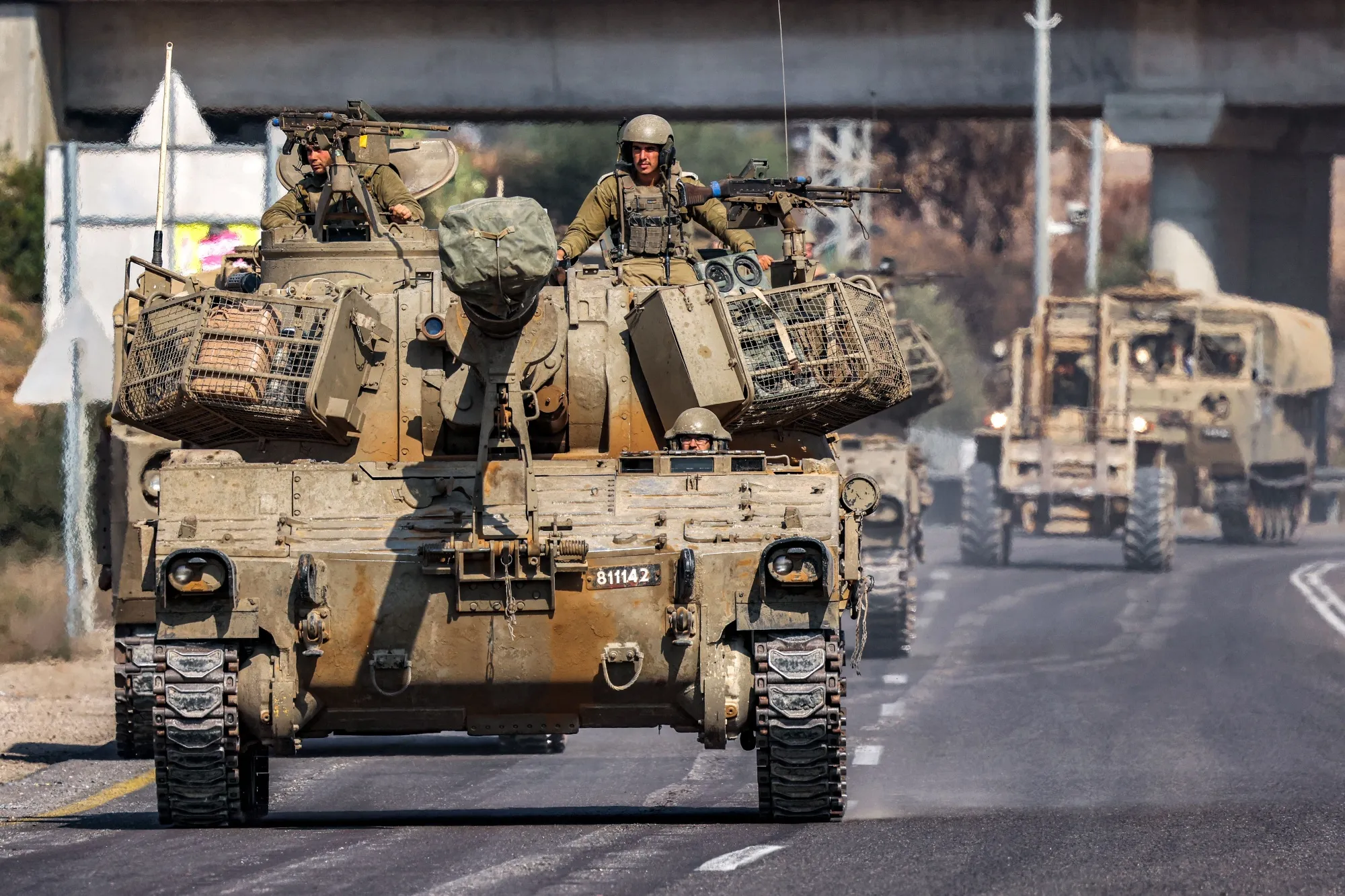 Israeli army self-propelled artillery howitzers move in a convoy along a road by the border with the Gaza Strip on Nov. 1.
