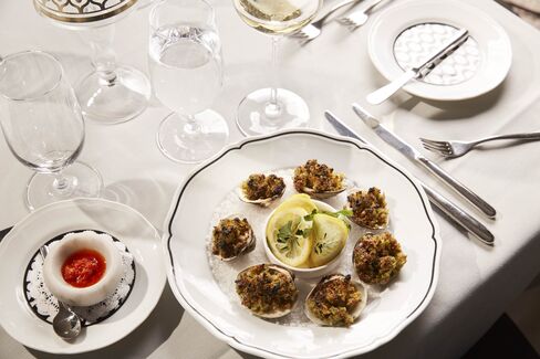 Clams with a Sicilian-style lemon salad and chili sauce.