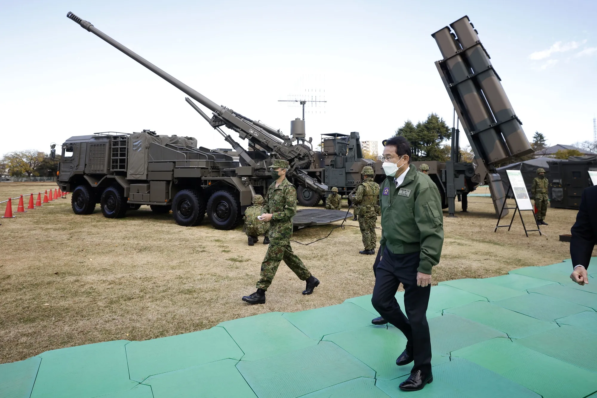 Fumio Kishida inspects military equipment at JGSDF Camp Asaka in Tokyo.