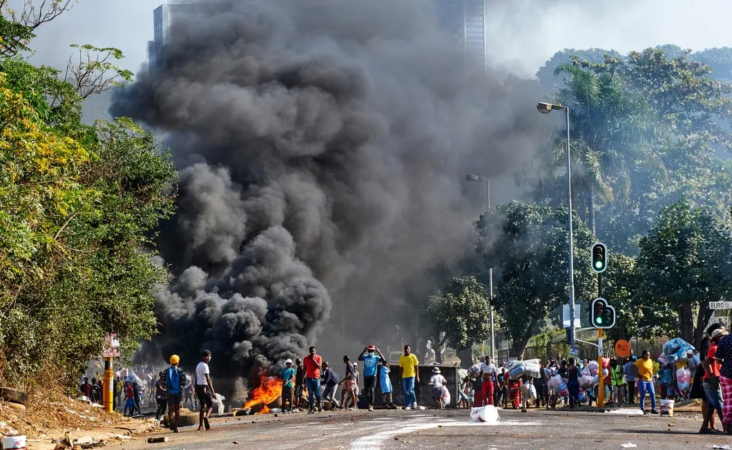 A barricade burns outside a shopping center in Durban, South Africa on&nbsp;July 12
