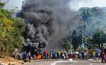 A barricade burns outside a shopping center in Durban, South Africa on July 12